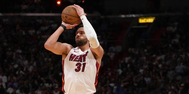 Max Strus of the Miami Heat shoots a 3-pointer during the 2023 play-in tournament against the Atlanta Hawks April 11, 2023, at Kaseya Center in Miami, Fla.