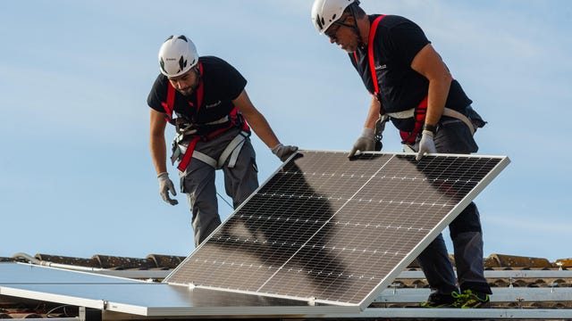 Installing solar panels on a roof