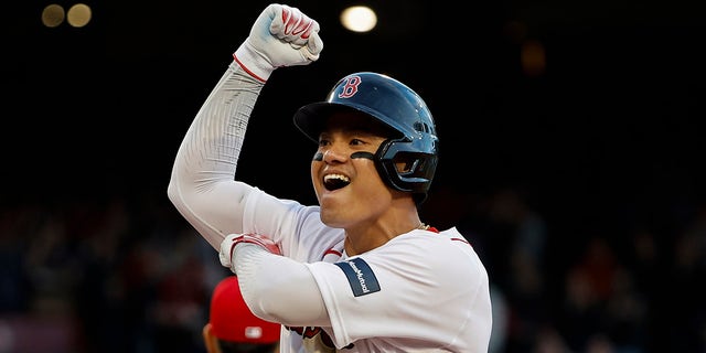 Yu Chang celebrates after his two-run single put the Red Sox ahead to stay against the Los Angeles Angels at Fenway Park on April 15, 2023, in Boston.