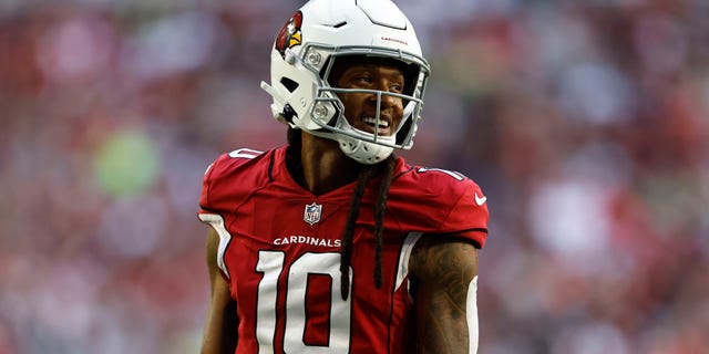 DeAndre Hopkins #10 of the Arizona Cardinals reacts as he looks on during an NFL Football game between the Arizona Cardinals and the Seattle Seahawks at State Farm Stadium on November 06, 2022 in Glendale, Arizona.