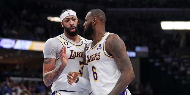 Anthony Davis #3 of the Los Angeles Lakers and LeBron James #6 of the Los Angeles Lakers during the first half against the Memphis Grizzlies during Game One of the Western Conference First Round Playoffs at FedExForum on April 16, 2023 in Memphis, Tennessee.