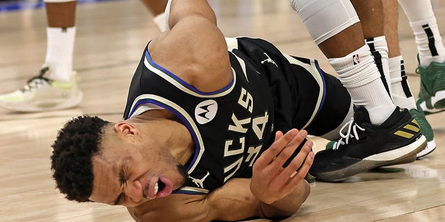 Giannis Antetokounmpo #34 of the Milwaukee Bucks is injured during Game One of the Eastern Conference First Round Playoffs against the Miami Heat at Fiserv Forum on April 16, 2023 in Milwaukee, Wisconsin.