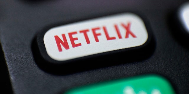 FILE - This Aug. 13, 2020, file photo shows a logo for Netflix on a remote control in Portland, Ore.