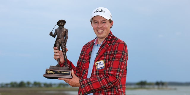 Matt Fitzpatrick of England celebrates with the trophy in the Heritage Plaid tartan jacket after winning in a playoff during the final round of the RBC Heritage at Harbour Town Golf Links on April 16, 2023 in Hilton Head Island, South Carolina.