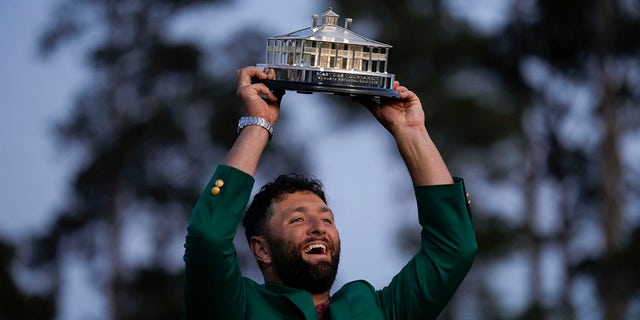 Jon Rahm, of Spain, celebrates holding the Masters trophy winning the Masters golf tournament at Augusta National Golf Club on Sunday, April 9, 2023, in Augusta, Georgia.