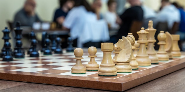 Pieces stand on a chess board at the Werner Ott Open of the Kreuzberg Summer at the Berlin Kreuzberg Chess Club.