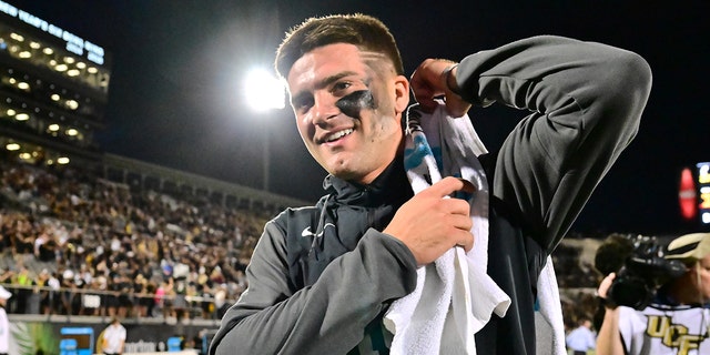 John Rhys Plumlee #10 of the UCF Knights walks back to the locker room after defeating the Cincinnati Bearcats 25-21 at FBC Mortgage Stadium on October 29, 2022 in Orlando, Florida.