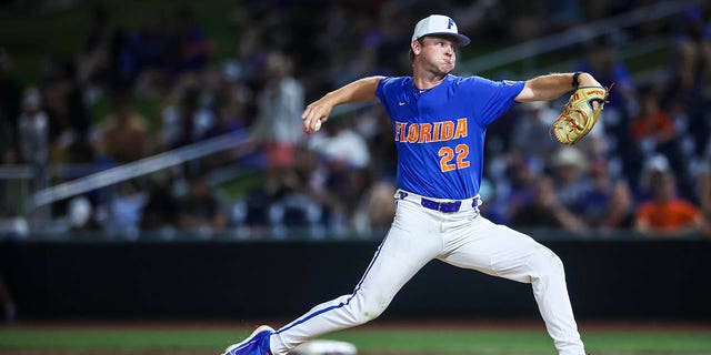 Brandon Neely #22 of the Florida Gators throws a pitch during a game against the Auburn Tigers at Condron Family Ballpark on April 01, 2023 in Gainesville, Florida.