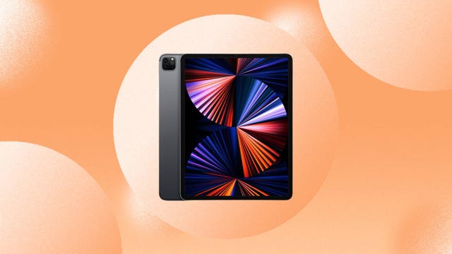 The Apple iPad Pro with an M1 chip from 2021 is displayed against an orange background.