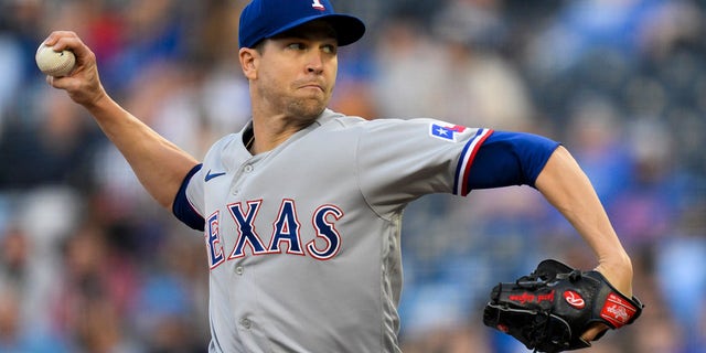 Texas Rangers starting pitcher Jacob deGrom throws to a Kansas City Royals batter during the first inning of a baseball game, Monday, April 17, 2023, in Kansas City, Mo.