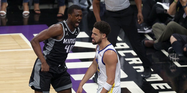 Harrison Barnes #40 of the Sacramento Kings reacts after he dunked the ball on Klay Thompson #11 of the Golden State Warriors in the first half during Game Two of the Western Conference First Round Playoffs at Golden 1 Center on April 17, 2023 in Sacramento, California. 