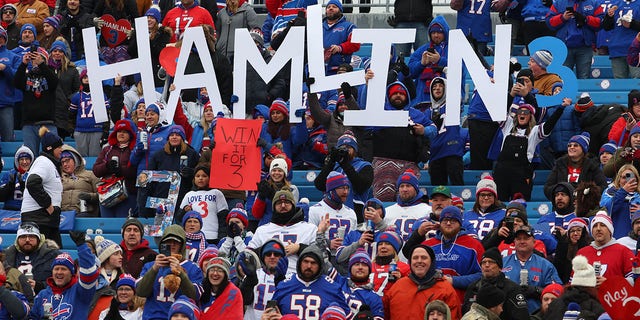 Buffalo Bills fans hold signs in support of Buffalo Bills safety Damar Hamlin prior to the game between the Buffalo Bills and the New England Patriots at Highmark Stadium on January 8, 2023 in Orchard Park, New York.