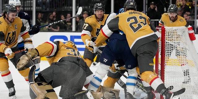 Vegas Golden Knights goaltender Laurent Brossoit (39) grabs the puck against the Winnipeg Jets during the first period of Game 1 of an NHL hockey Stanley Cup first-round playoff series Tuesday, April 18, 2023, in Las Vegas. 