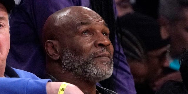 Mike Tyson watches the first half of an NBA basketball game between the Los Angeles Lakers and the New Orleans Pelicans, Feb. 27, 2022, in Los Angeles. A woman has accused former heavyweight boxing champion Tyson of raping her sometime in the early 1990s in a lawsuit filed in January 2023, in Albany, New York.