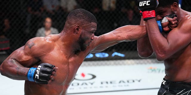 From left to right, Karl Roberson punches Kennedy Nzechukwu of Nigeria in their light heavyweight fight during the UFC Fight Night event at UFC APEX on July 9, 2022 in Las Vegas.