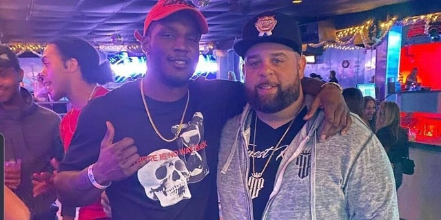 Ex-UFC fighter Karl Roberson, left, takes photo with Ryan Leonard. Roberson was charged with home burglary after allegedly robbing Leonard of $200,000 worth of jewelry.