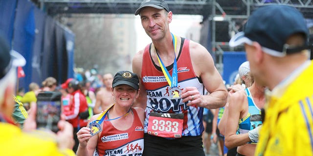 Zdeno Chara crosses the finish line at the Boston marathon