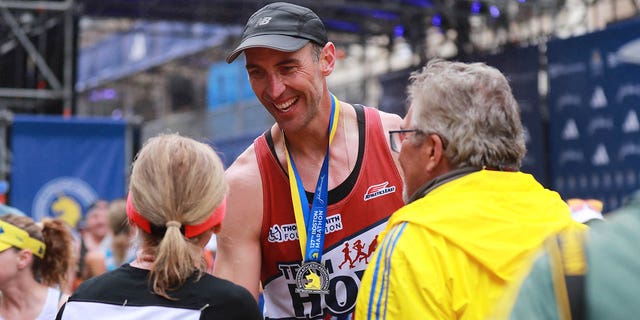 Zdeno Chara crosses the finish line at the Boston marathon