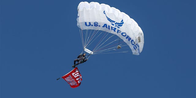 Paratroopers descend prior to the MLB opening day baseball game between the Texas Rangers and Cleveland Indians on April 3, 2017 at Globe Life Park in Arlington, Texas.