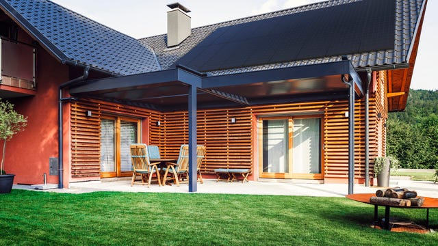 Solar panels on a wooden house.