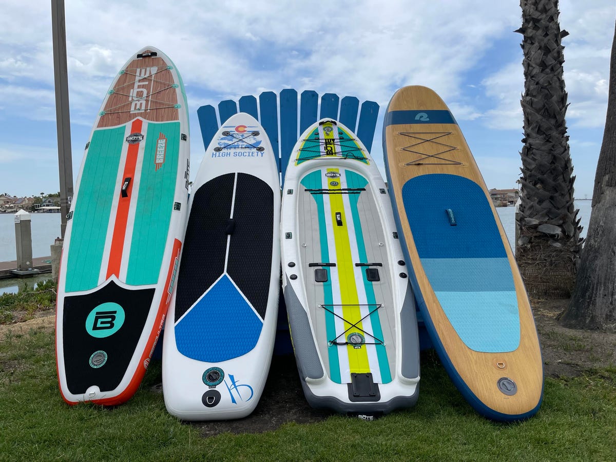 5 paddle boards stacked together