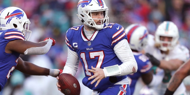 Buffalo Bills quarterback Josh Allen (17) runs a play during the second half of an NFL wild-card playoff game against the Miami Dolphins Jan. 15, 2023, in Orchard Park, N.Y.