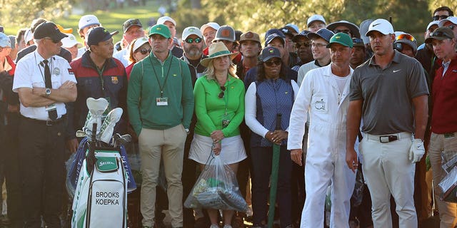 Brooks Koepka talks with his caddie Ricky Elliott on the 17th hole during the final round of the Masters Tournament at Augusta National Golf Club on April 9, 2023. 