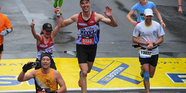 Zdeno Chara crosses the finish line at the Boston marathon