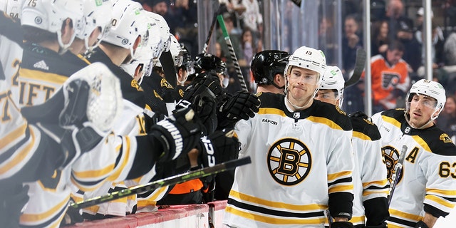 Charlie Coyle celebrates his first-period goal against the Flyers with his Boston Bruins teammates at the Wells Fargo Center on April 9, 2023, in Philadelphia.