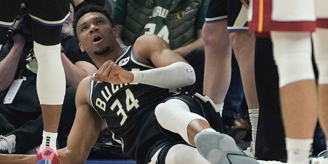 Milwaukee Bucks' Giannis Antetokounmpo lies on the floor after an injury during the first half in Game 1 of an NBA basketball first-round playoff game Sunday, April 16, 2023, in Milwaukee.