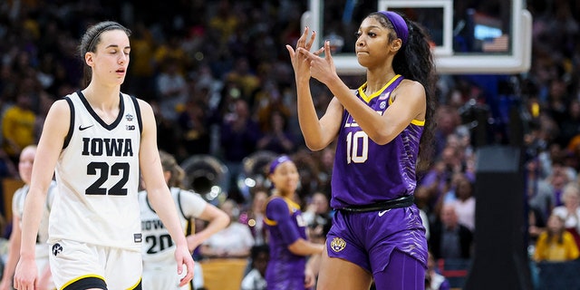 LSU Lady Tigers forward Angel Reese (10) gestures toward Iowa Hawkeyes guard Caitlin Clark (22) in the national championship game at American Airlines Center in Dallas, Texas, April 2, 2023.