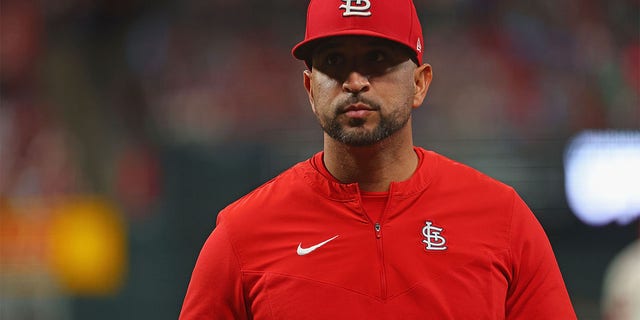 Manager Oliver Marmol of the Cardinals returns to the dugout after a pitching change against the Pittsburgh Pirates at Busch Stadium on Oct. 1, 2022, in St Louis.