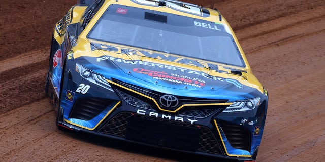 Christopher Bell, driver of the #20 DeWalt Power Stack Toyota, drives during qualifying heat #1 for the NASCAR Cup Series Food City Dirt Race on Dirt at Bristol Motor Speedway on April 08, 2023 in Bristol, Tennessee.