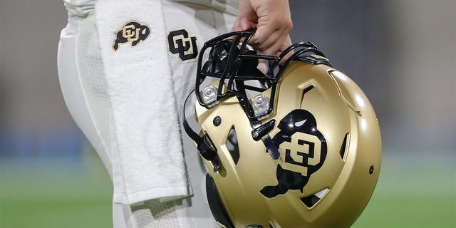 A player holds a Colorado Buffaloes helmet before the college football game between the Colorado Buffaloes and the Arizona State Sun Devils on Sept. 25, 2021 at Sun Devil Stadium in Tempe, Arizona.