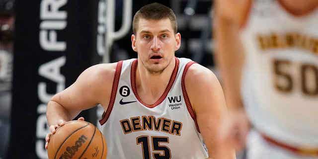 Nikola Jokic, the center for the Denver Nuggets, brings the ball up court during the first half of a game against the Utah Jazz, on April 8, 2023, in Salt Lake City, Utah. 