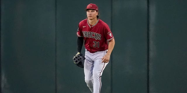 Jake McCarthy #31 of the Arizona Diamondbacks plays center field in the first inning against the Cincinnati Reds during a spring training game at Goodyear Ballpark on March 10, 2023, in Goodyear, Arizona.