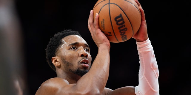 Cleveland Cavaliers guard Donovan Mitchell shoots a foul shot against the Hawks, Tuesday, March 28, 2023, in Atlanta.