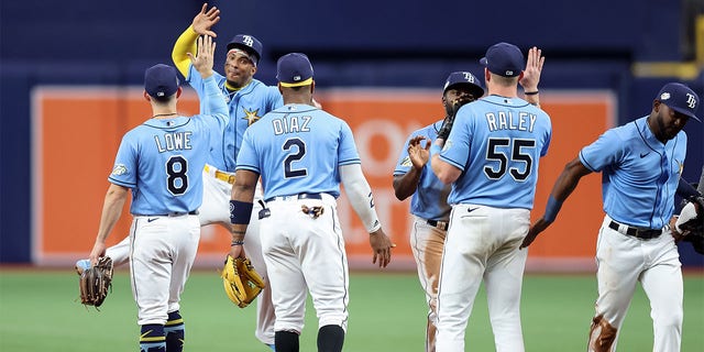 Members of the Tampa Bay Rays celebrate a win over the Boston Red Sox at Tropicana Field in St. Petersburg, Florida, on Monday.