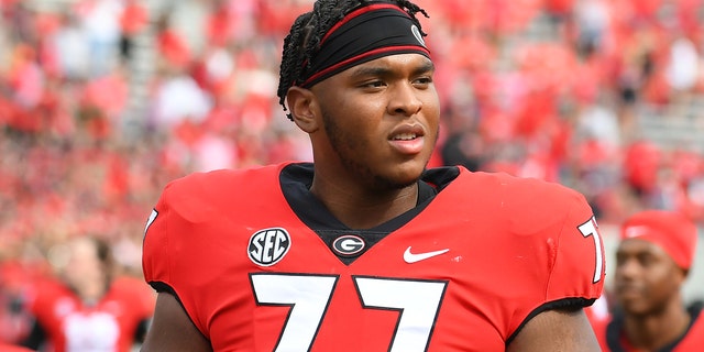 Georgia Bulldogs offensive linemen Devin Willock (77) after a game against the Arkansas Razorbacks Oct. 2, 2021, at Sanford Stadium in Athens, Ga.