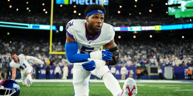 Kayvon Thibodeaux #5 of the New York Giants stretches against the Dallas Cowboys at MetLife Stadium on September 26, 2022 in East Rutherford, New Jersey.