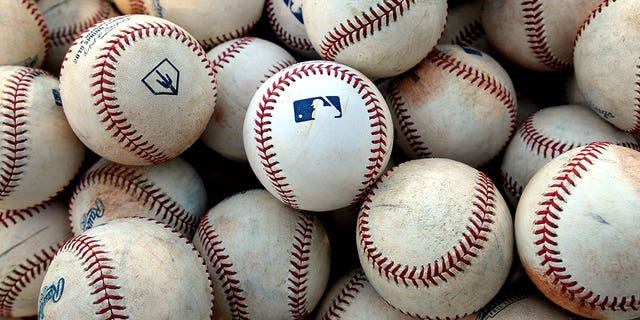 The MLB logo on batting practice balls before a game between the Peoria Javelinas and the Mesa Solar Sox at Sloan Park Sept, 21, 2019 in Mesa, Ariz. 