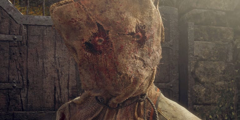 Two round, seemingly popped-out eyes stare forth from a pair of holes torn in a bloody burlap sack, which has been thrown over someone's head and secured around the neck with a rope.