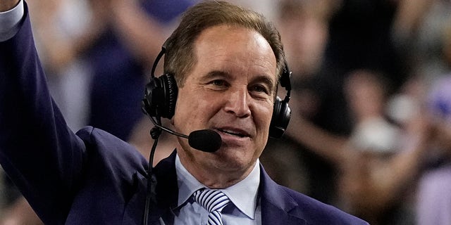 Jim Nantz waves to the crowd during the NCAA Tournament on April 1, 2023, in Houston.