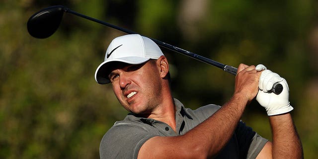 Brooks Koepka plays his shot from the 15th tee during the final round of the Masters Tournament at Augusta National Golf Club on April 9, 2023.