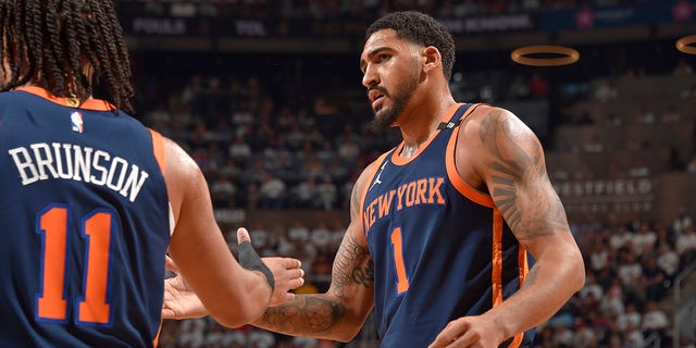 The New York Knicks' Obi Toppin (1) high-fives Jalen Brunson (11) against the Cleveland Cavaliers during Game 1 of the first round of the NBA Playoffs April 15, 2023, at Rocket Mortgage FieldHouse in Cleveland.