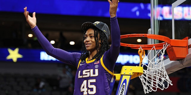 Alexis Morris of the LSU Lady Tigers poses during the net cutting ceremony after defeating the Iowa Hawkeyes, 102-85, during the NCAA Women's Basketball Tournament championship game at American Airlines Center on April 2, 2023, in Dallas, Texas.