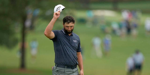 Jon Rahm of Spain waves after his putt on the 18th hole during the first round of the Masters at Augusta National Golf Club Thursday, April 6, 2023, in Augusta, Ga.