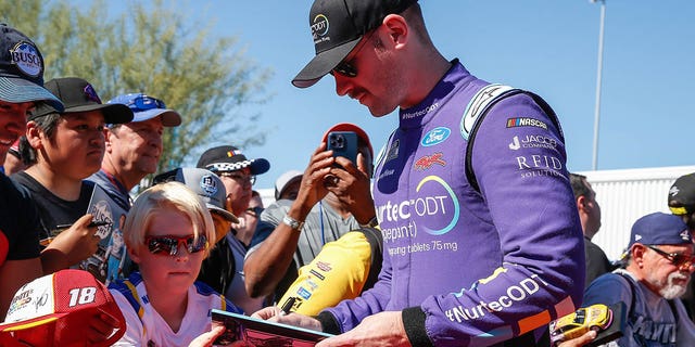 Cody Ware (#51 Rick Ware Racing Nurtec ODT (Rimegepant) Ford) signs autographs before the NASCAR Cup Series Championship Race on November 6, 2022 at Phoenix Raceway in Avondale, Arizona. (Photo by 