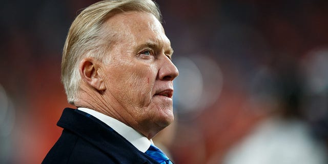 John Elway stands on the sideline during the fourth quarter of a game between the Denver Broncos and the Los Angeles Chargers at Empower Field at Mile High Dec. 1, 2019, in Denver, Colo.