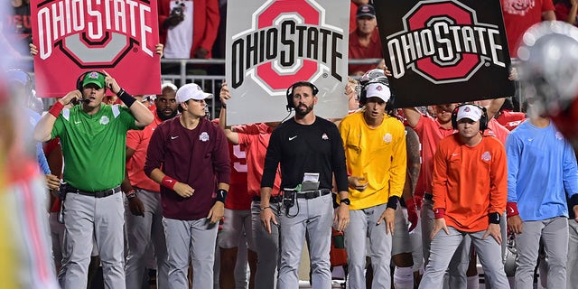 Ohio State wide receivers coach Brian Hartline, center, stands during the fourth quarter of an NCAA college football game against Notre Dame on Sept. 3, 2022, in Columbus, Ohio.
